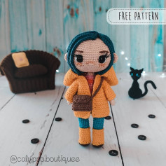 crochet doll blue hair orange shirt