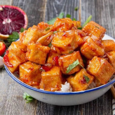 Spicy blood orange tofu served with rice