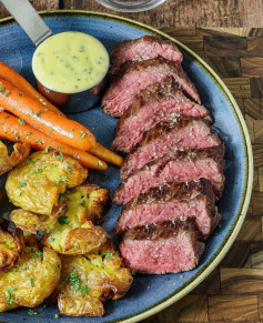 Teres Major steak, sauce béarnaise, crushed potatoes and honey glazed carrots.