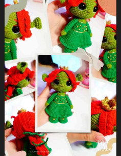 Patrón de muñeca amigurumi verde con vestido y cabello rojo brillante