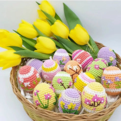 Crochet Easter Eggs with Colorful Floral Designs in a Basket