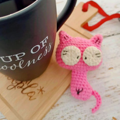 Cute Pink Crochet Cat Toy Pattern Next to Coffee Mug
