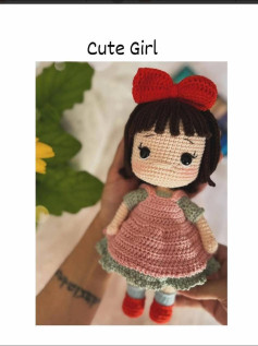 Adorable Crochet Doll with Red Bow and Pink Dress