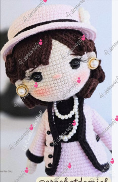 Elegant Crochet Doll with Stylish Hat and Pearl Necklace