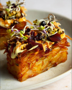 Golden Vegan Potato Terrine with Caramelized Onions and Sprouts