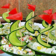 Spooky Cucumber Ships with Hummus Sails