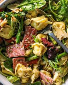 Vibrant Pesto Tortellini Delight with Salami and Pistachios