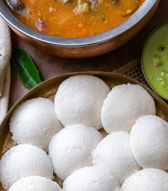 Fluffy Idli Delight with Spicy Sambhar and Coconut Chutney