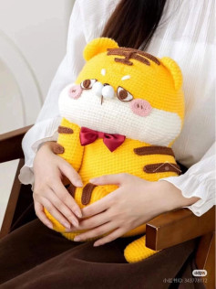 Adorable Crochet Plush Toy with a Red Bow Tie