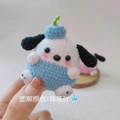 Chú chó len dễ thương với mũ xanh và tai đen