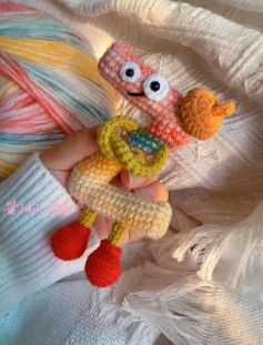 Colorful Crochet Worm with Red Feet and Snail Friend