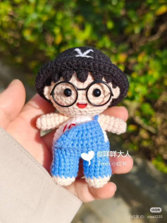 Crochet Amigurumi Doll with Glasses and Blue Overalls
