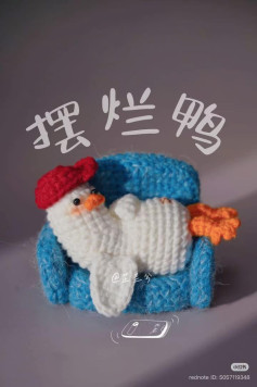 Crochet Duck Relaxing on a Cozy Blue Couch