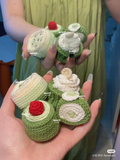 Crocheted Green Tea Roll Cakes with Cream and Cherry Topping