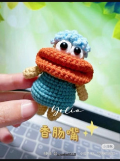 Cute Amigurumi Crocheted Doll with Big Eyes and Hat