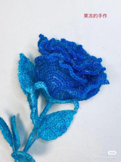 Elegant Blue Crochet Rose Pattern with Shimmering Yarn Detail