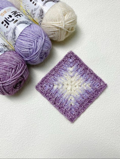Elegant Crochet Square Pattern with Soft Purple Gradient Yarn