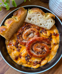 Sizzling Sausage Delight with Creamy Roasted Veggie Beans