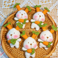 Adorable Crochet Bunnies Holding Carrots in a Woven Basket
