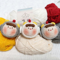 Amigurumi Monkey Faces with Colorful Yarn Background