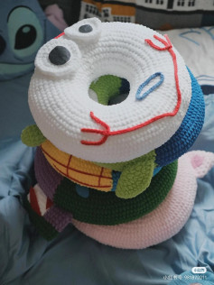 Colorful Crocheted Donut Stacker with Cute Animal Faces