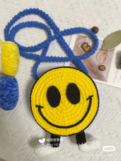 Crochet Smiley Face Bag with Blue Strap and Yellow Yarn