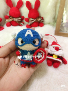 Cute Captain America Crochet Doll with Red Bunnies and Santa Background