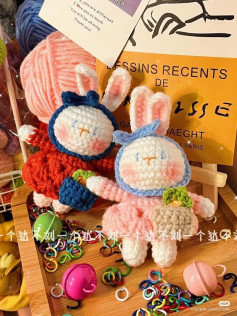 Cute Crochet Bunny Pair with Accessories and Yarn Display