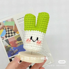 Cute Crochet Bunny with Green Ears and Cheerful Smile