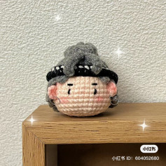 Cute Crochet Character with Gray Hair and Earrings