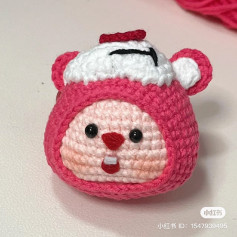 Cute Pink Crocheted Animal Toy with Adorable Face