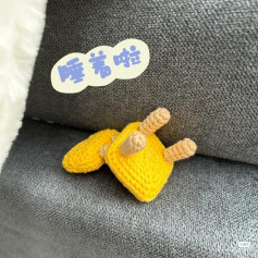Cute Yellow Crochet Creature Sleeping on the Sofa