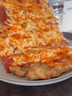Golden Crispy Chicken Parmesan with Melted Mozzarella and Rich Marinara