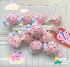 Adorable Crochet Piglets with Flowers and Milk Bottles