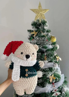 Cute Crochet Bear with Christmas Tree Background