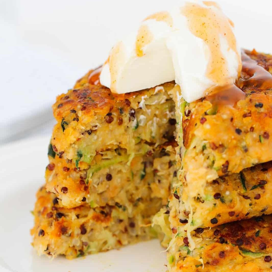 Cheesy Sweet Potato, Zucchini & Quinoa Fritters: Crispy, healthy veggie fritters with sour cream