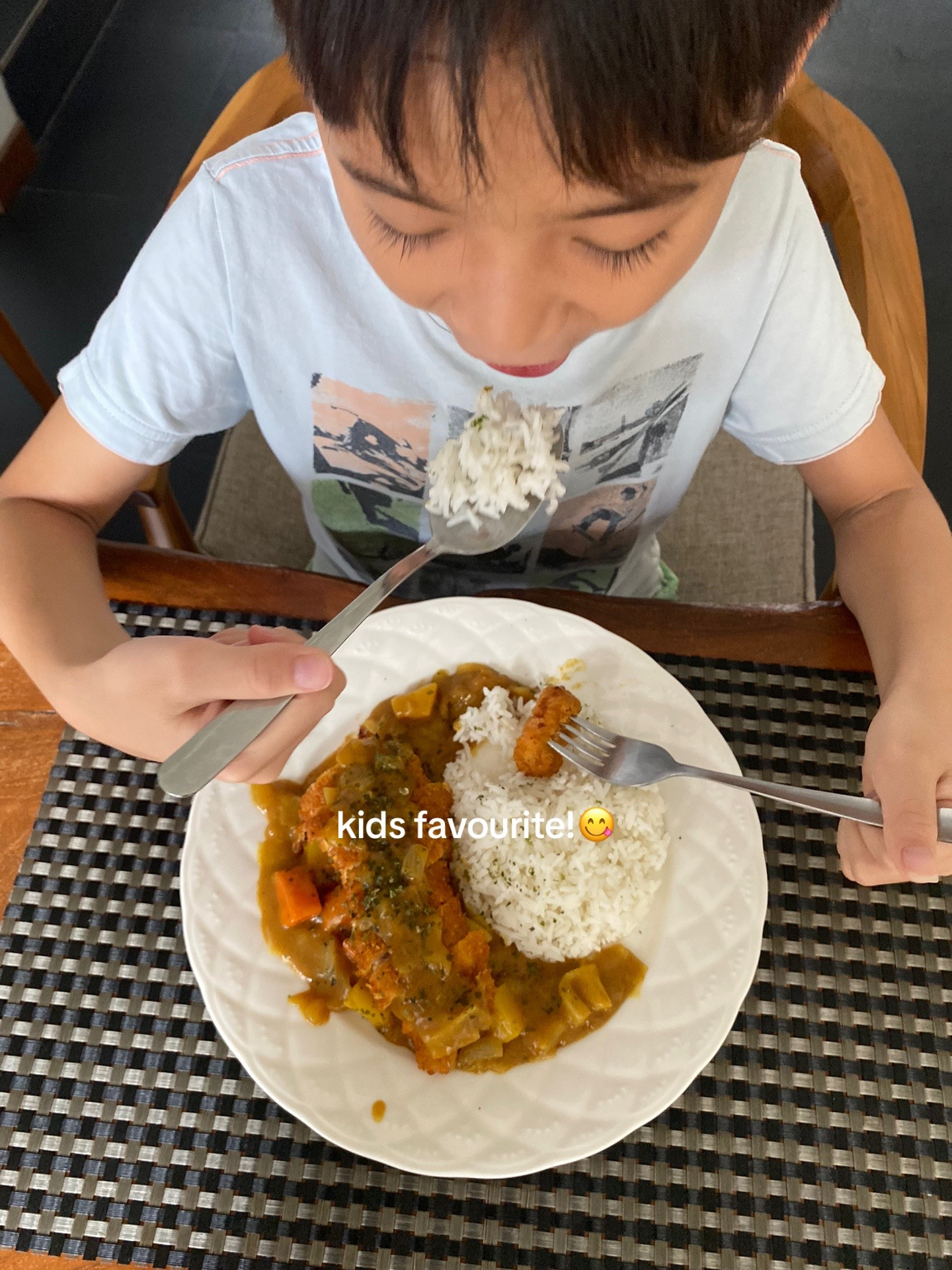 Chicken Katsu Curry with rice, crispy fried chicken breast served in savory curry sauce