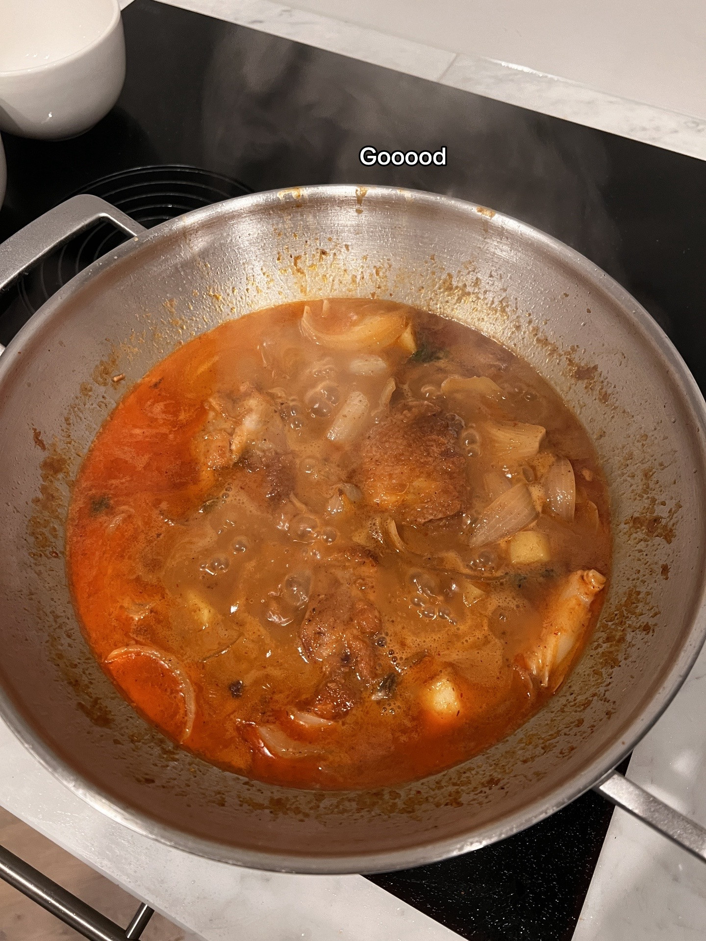 Chicken Massaman Curry with rice, topped with cashew & coriander