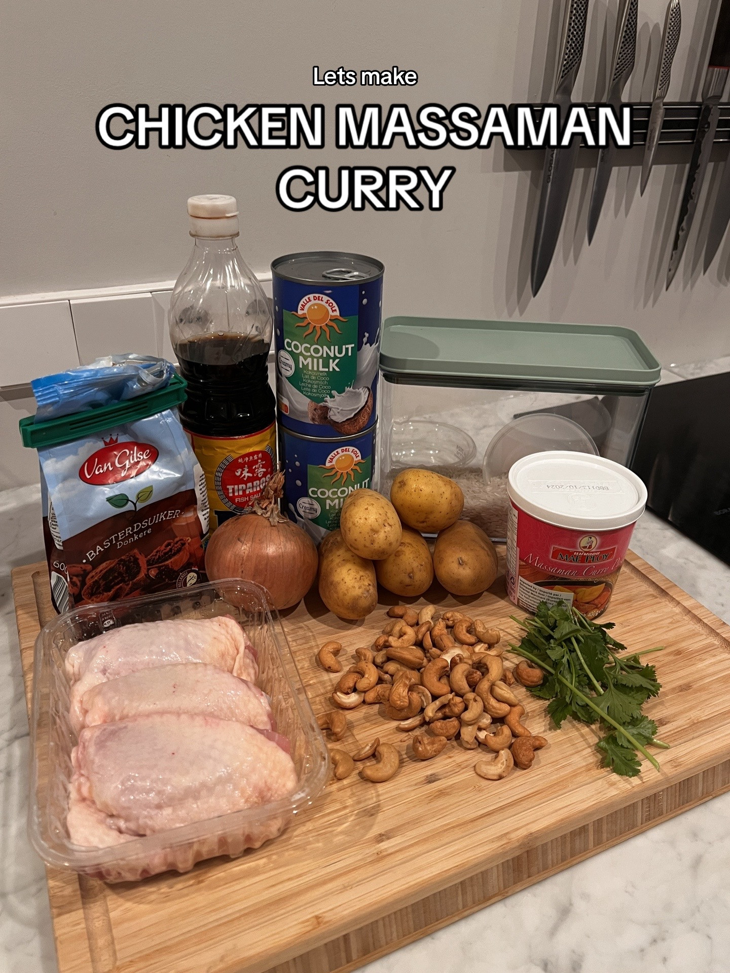 Chicken Massaman Curry with rice, topped with cashew & coriander