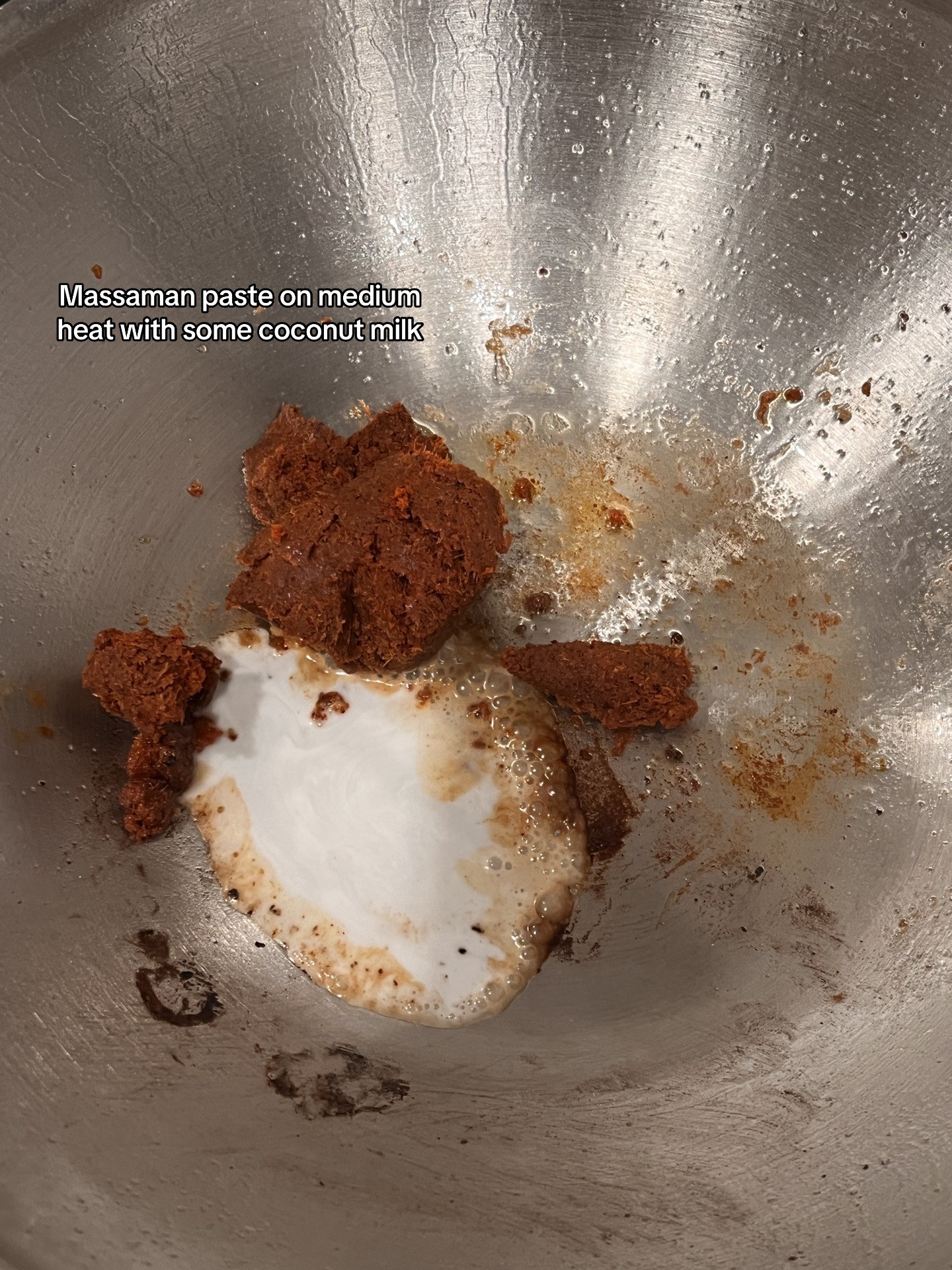 Chicken Massaman Curry with rice, topped with cashew & coriander