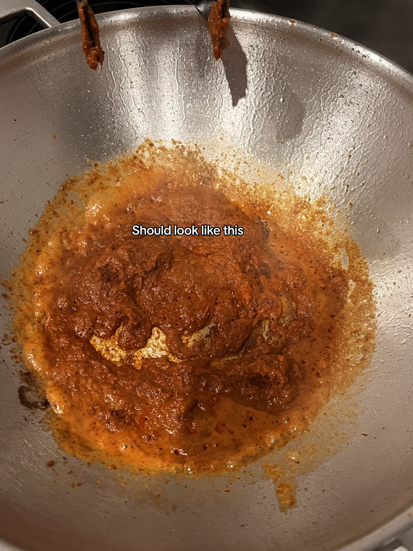 Chicken Massaman Curry with rice, topped with cashew & coriander