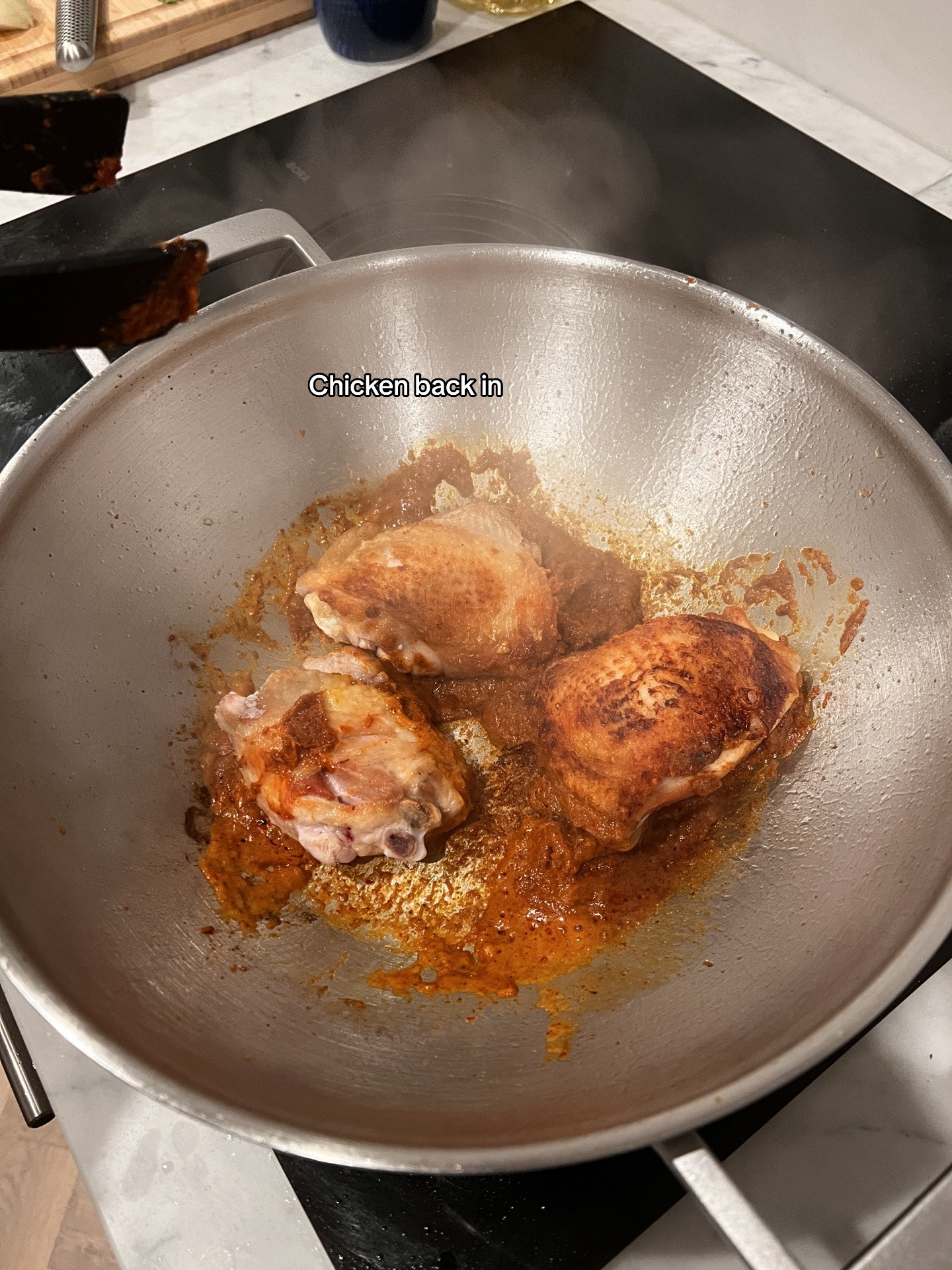 Chicken Massaman Curry with rice, topped with cashew & coriander