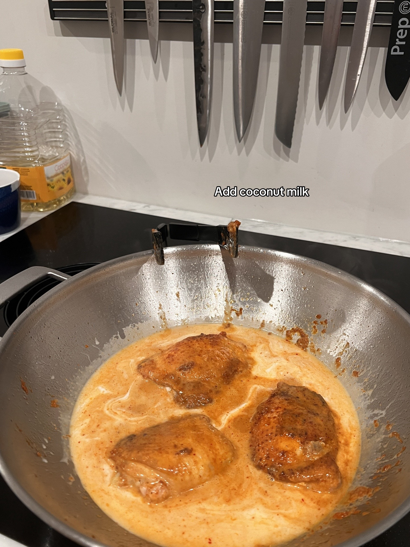 Chicken Massaman Curry with rice, topped with cashew & coriander