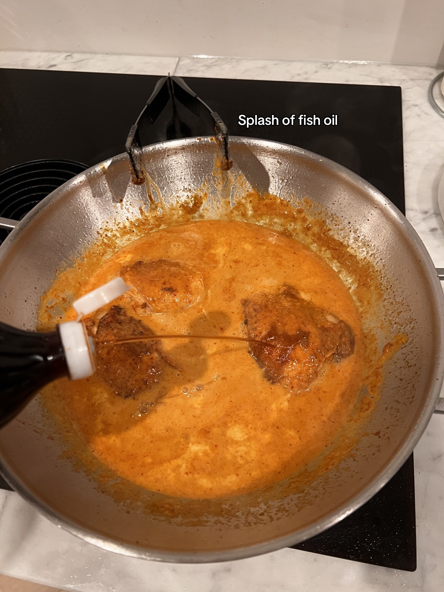 Chicken Massaman Curry with rice, topped with cashew & coriander