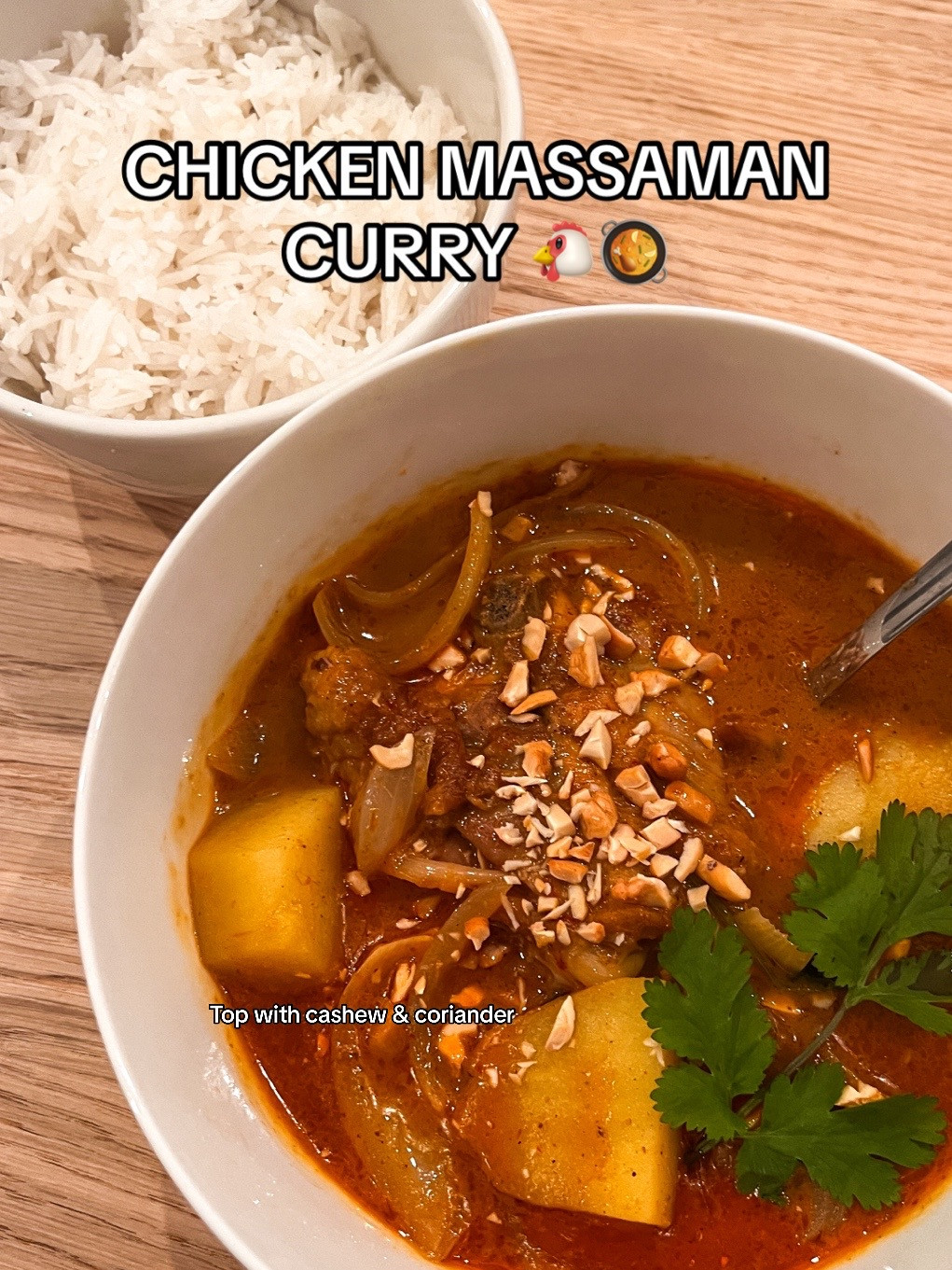 Chicken Massaman Curry with rice, topped with cashew & coriander