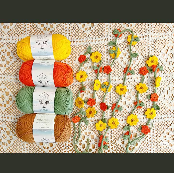 Crochet floral headband pattern with yellow and orange flowers