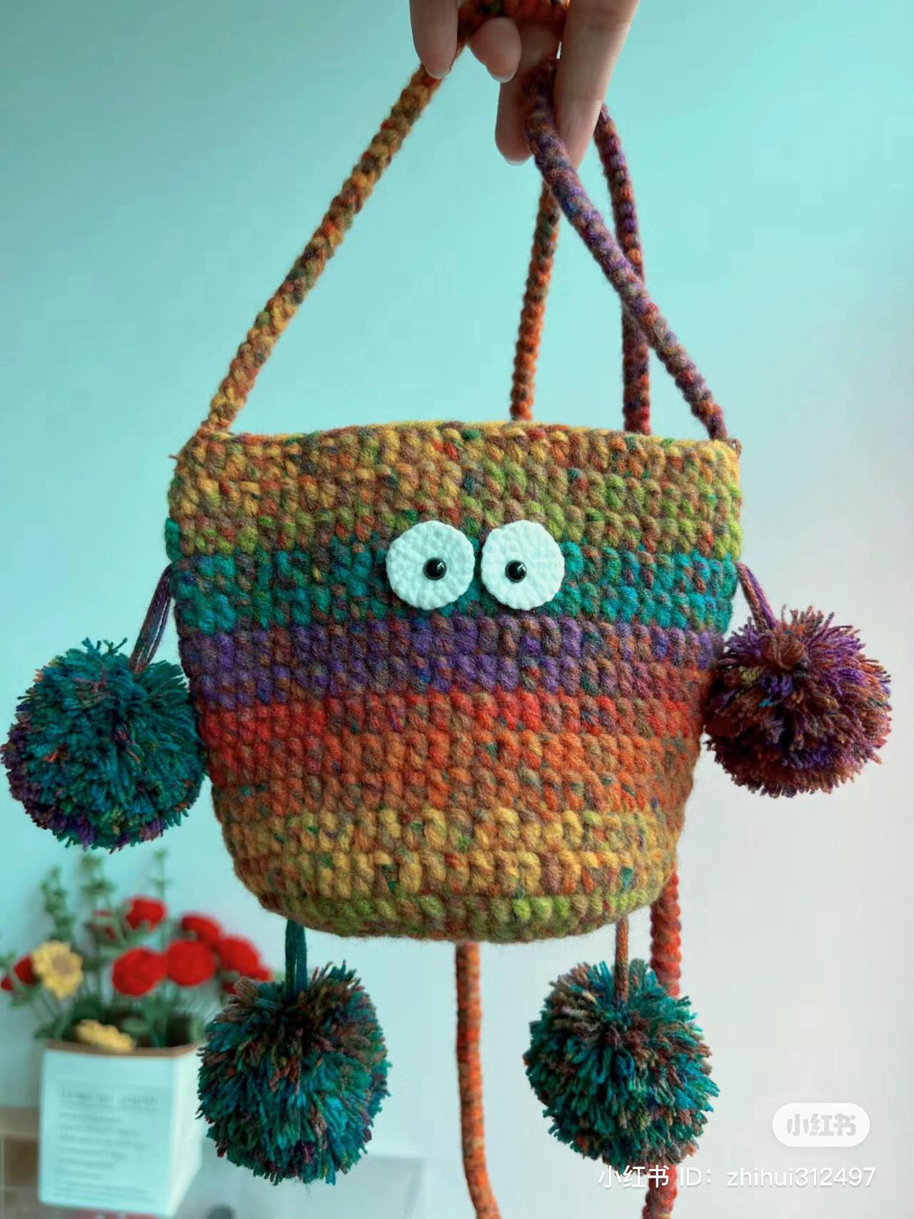 Crochet pattern for colorful monster bag with pompom details