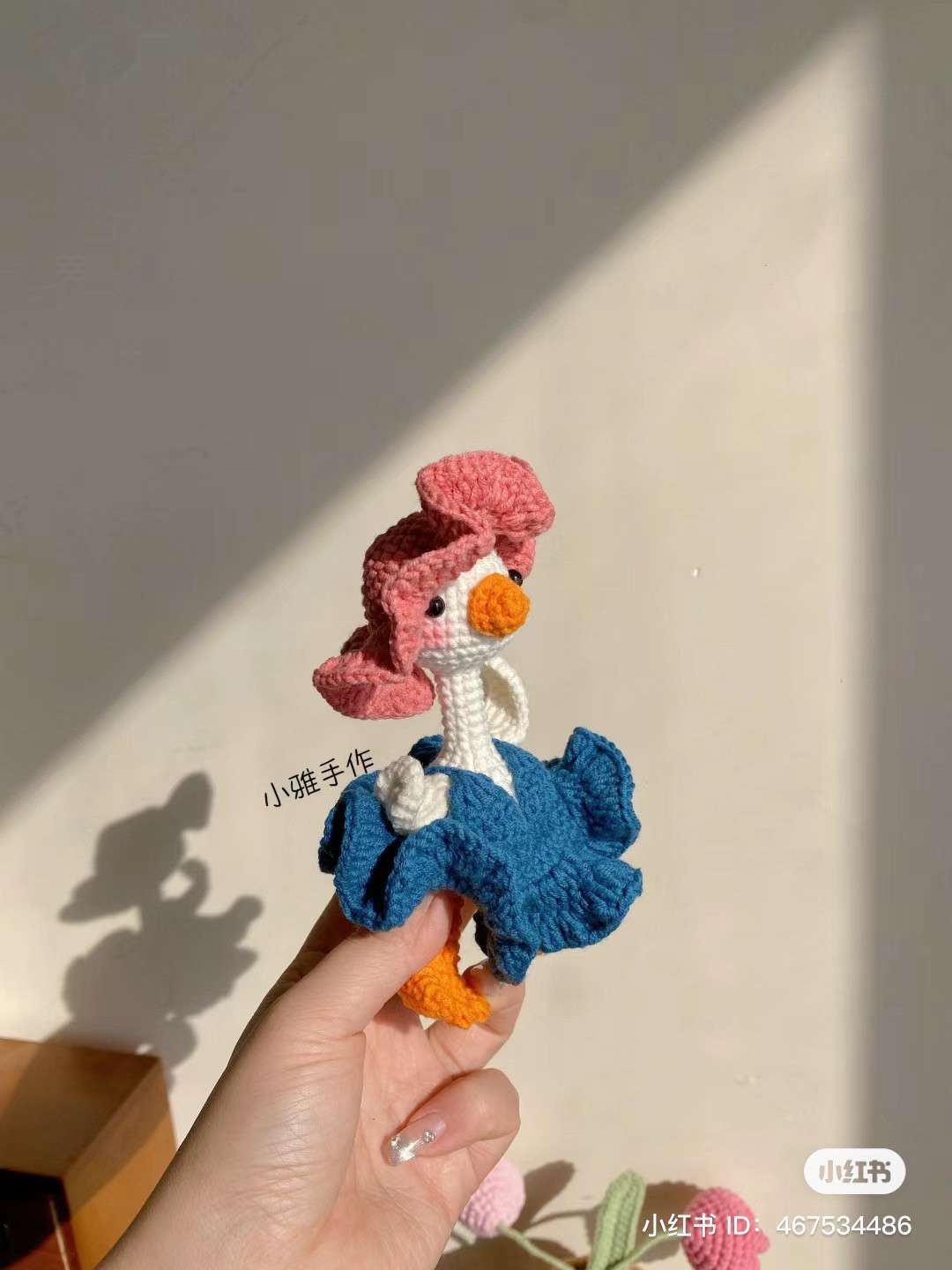 Crochet pattern for cute white duck doll with pink hat and blue dress
