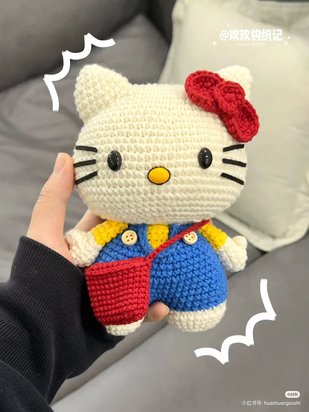Crochet pattern for Hello Kitty amigurumi doll with blue overalls and red bow