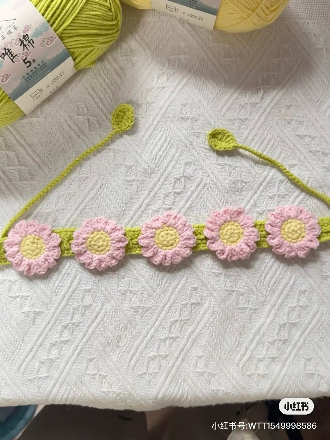 Crochet Pet Daisy Collar Pattern with Pink Flowers and Green Leaves